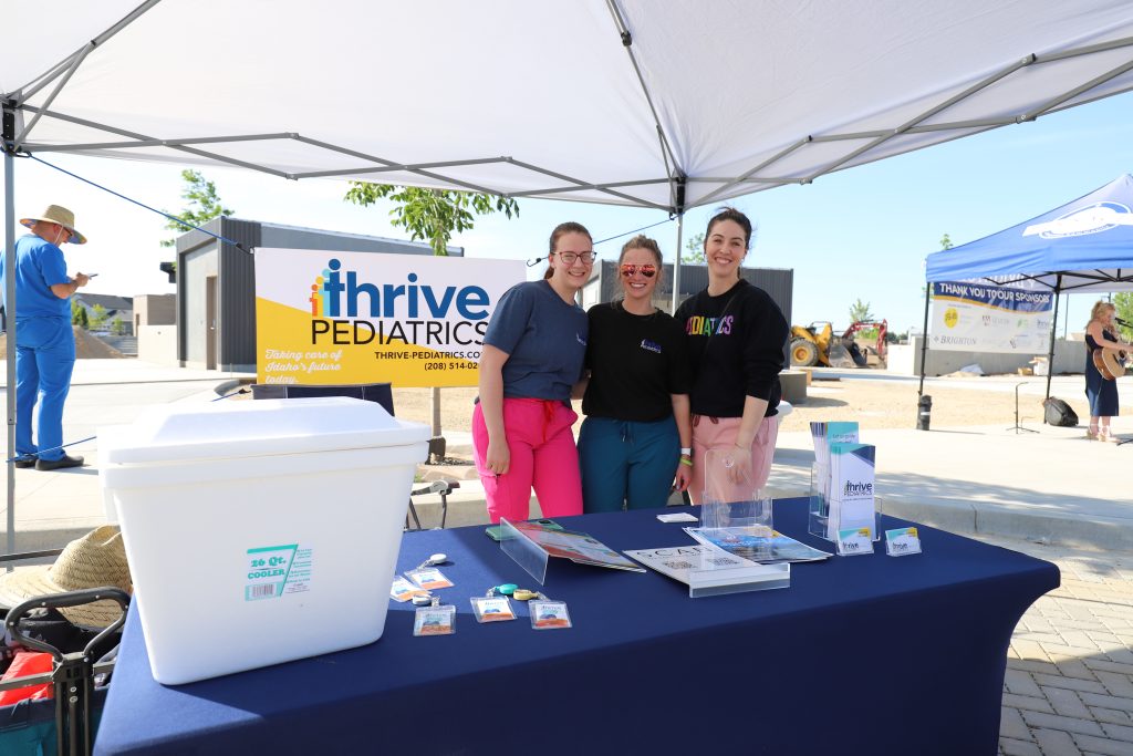 Thrive pediatric booth runners pose