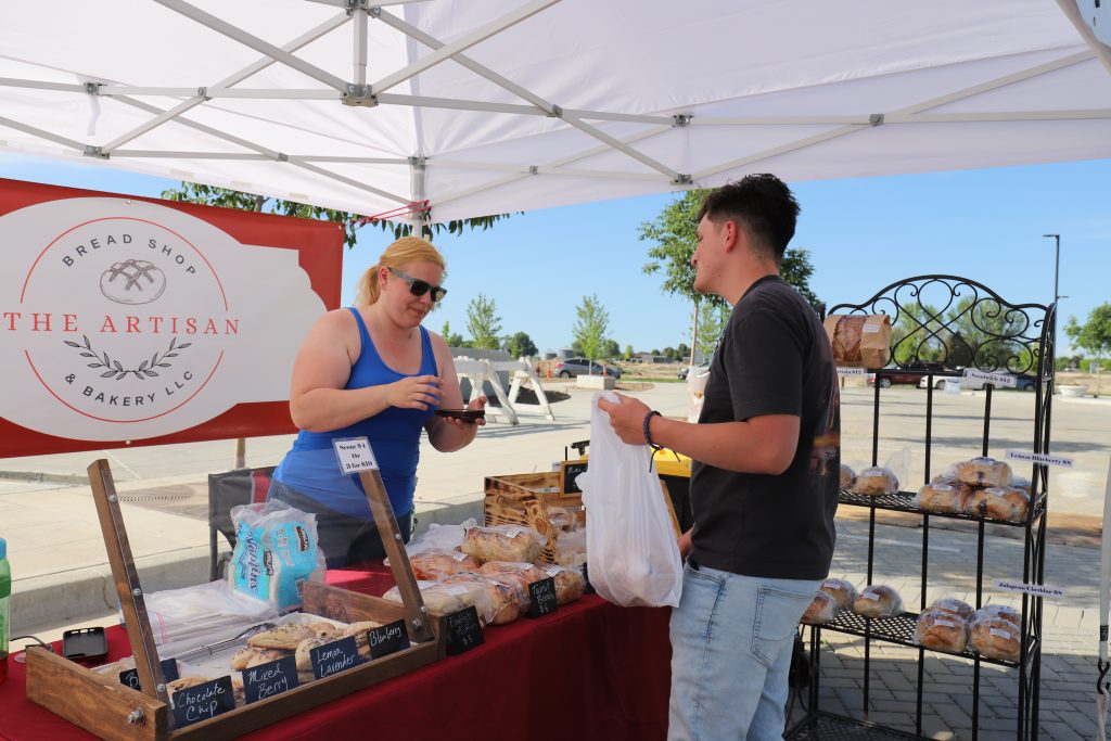 vendor giving customer their goods
