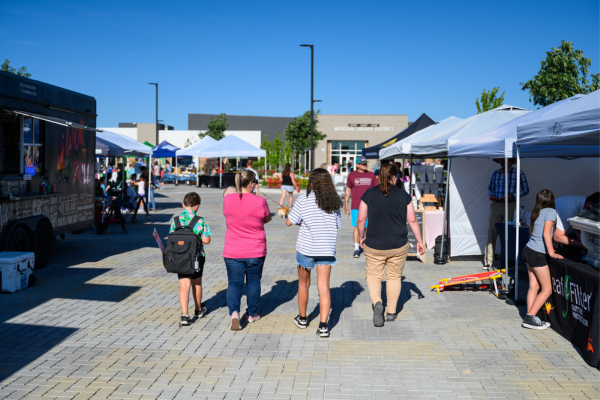 people walking down the market road