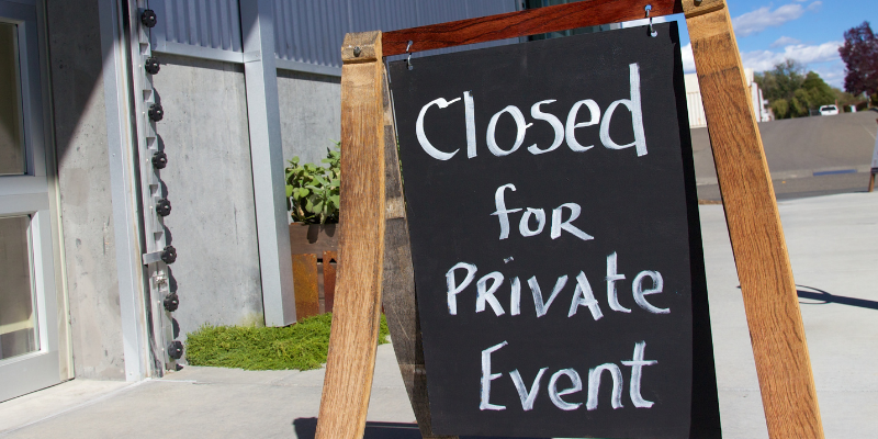 chalkboard sign with the words "closed for Private Event" written on it